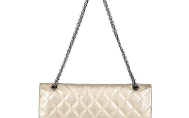 CHANEL - a metallic gold quilted 2.55 Reissue Flap 227
