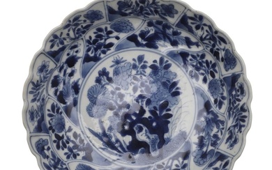CHINESE BLUE & WHITE DISH - KANGXI. A small lobed and ribbed...