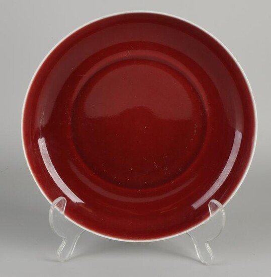 Chinese porcelain plate with red glaze.