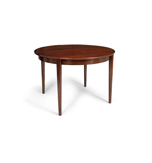 DINING TABLE A rosewood circular extending dining table...