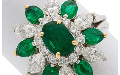 Emerald, Diamond, Platinum, Gold Ring The ring centers an...