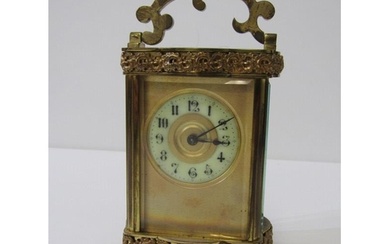 FRENCH BRASS BOUND CARRIAGE CLOCK with bevelled glass panels...