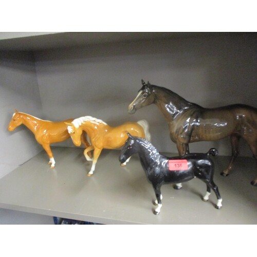 Four Beswick models of horses to include a palomino Conditio...
