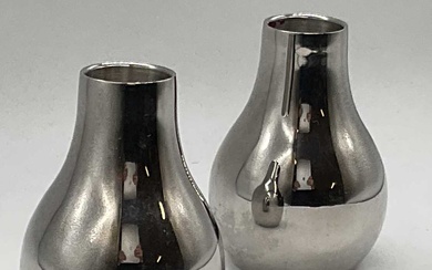 GEORG JENSEN; a pair of stainless steel candle holders, height...
