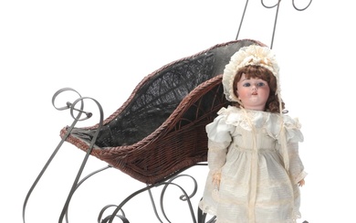 German Heinrich Handwerck Porcelain Doll with Wicker Doll Sled, Early 20th C.