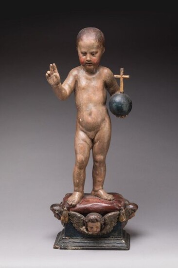 ITALIAN School of the XVIIIth century Blessed Child Jesus Carved polychrome wood on a base decorated with a cushion and three winged putti heads. Handwritten label on the back: "Sculpted by (?) after the print of Martin Schaungauer, German artist...