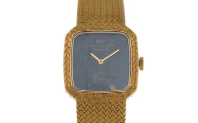 IWC - a lady's yellow metal bracelet watch.