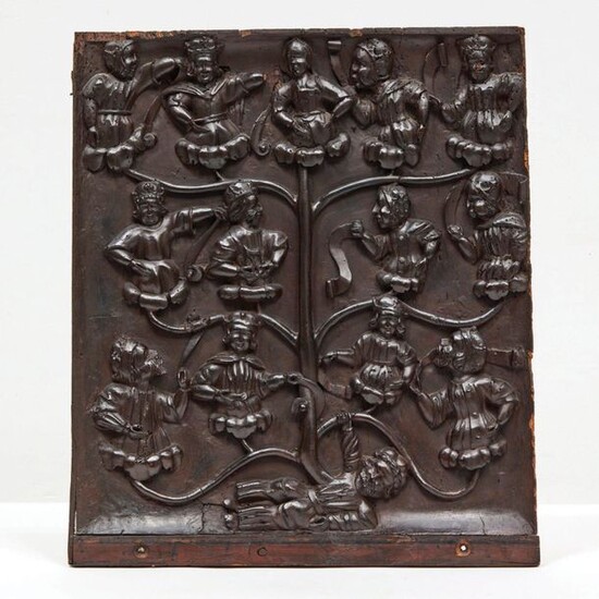 LARGE PANEL of dresser door in walnut carved in high relief representing the Tree of Jesse. At the lower part, Jesse is lying down, holding in his right hand a branch of the tree from his body; each branch of this tree bears the great biblical...