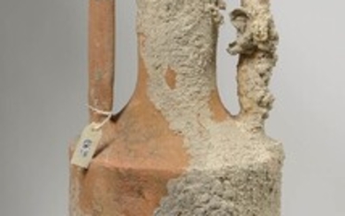 Large terracotta amphora decorated with marine concretions. Roman work. Period: 1st century AD. A certificate of origin is attached. L.:+/-111cm.