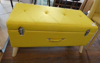 Modern yellow upholstered ottoman in the form of a caseCondition...