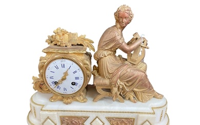 Ornate alabaster and ormolu mantel clock mounted with seated...