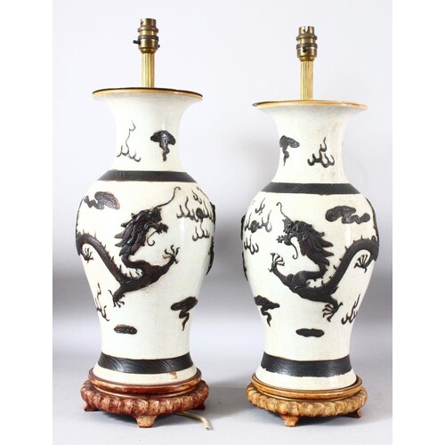 PAIR OF CHINESE CRACKLE GLAZE PORCELAIN LAMP VASES, on fitte...