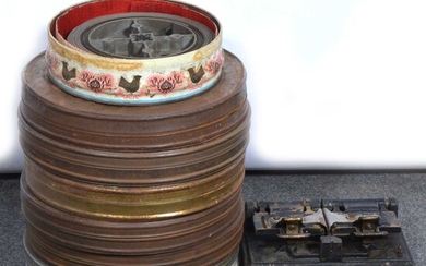 Seven film reel-to-reel films, in metal cases, including 'Romance of Foreign Legion'