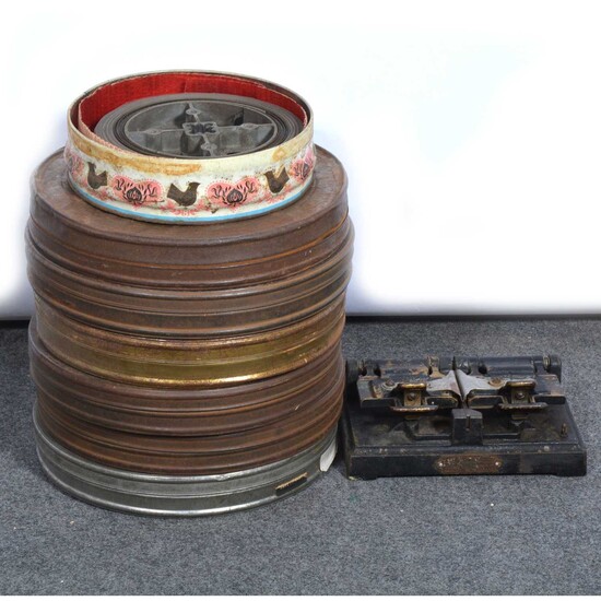 Seven film reel-to-reel films, in metal cases, including 'Romance of Foreign Legion'