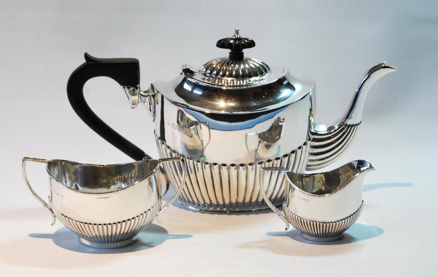 Silver composite three-piece tea set, oval fluted, Chester 1...