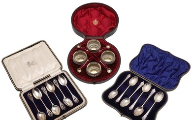TWO CASED SETS OF SILVER TEASPOONS. a set of six with open-w...