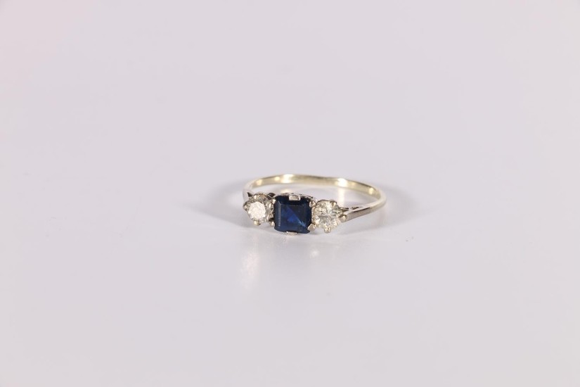 Three stone ring with square sapphire and two diamond brilli...