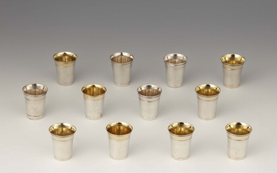 Twelve miniature silver beakers