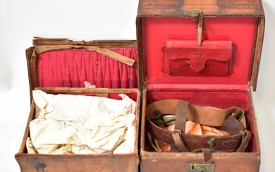 Two early 20th century leather travelling trunks of small proportions,...