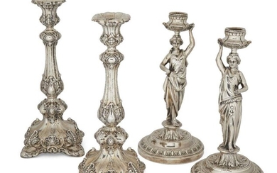Two pairs of white metal candlesticks, the...