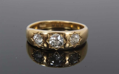 Victorian diamond three stone gypsy ring with three old cut diamonds in star shape gypsy setting on plain tapered shank. Estimated total diamond weight approximately 0.75cts.