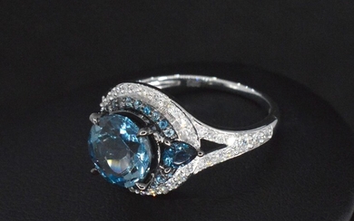 White gold ring with diamonds and topaz