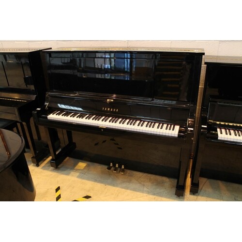 Yamaha (c1986) A Model U30 upright piano in a bright ebonise...