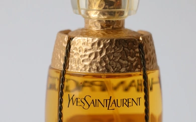 Yves Saint Laurent. "Champagne". Flacon à parfum 50 ml. Haut. : 10 cm.