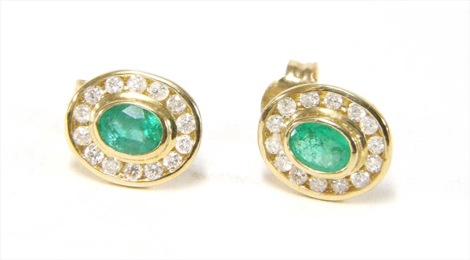 A pair of 9ct gold emerald and diamond cluster earrings