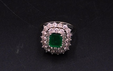 18kt white gold diamond and emerald lady's ring.