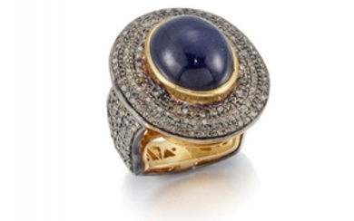 A cabochon sapphire and diamond ring, the...