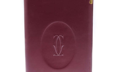 CARTIER - a Must De Cartier Bordeaux leather writing cover with inserts. View more details