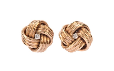 A pair of gold and diamond earstuds, by...