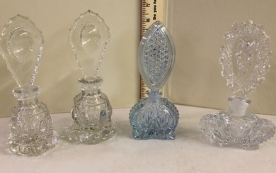 4 vintage perfume bottles with stoppers
