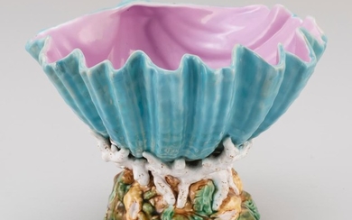 GEORGE JONES MAJOLICA SHELL-FORM CENTERPIECE Shell with turquoise-colored exterior and pink interior. Mottled base with coral and sh...