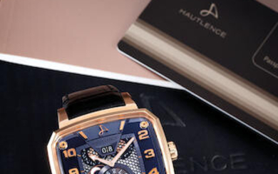 Hautlence. A Pink Gold and Black DLC Titanium Rectangular Wristwatch with Dual Time Zone, Date and Moon-Phases