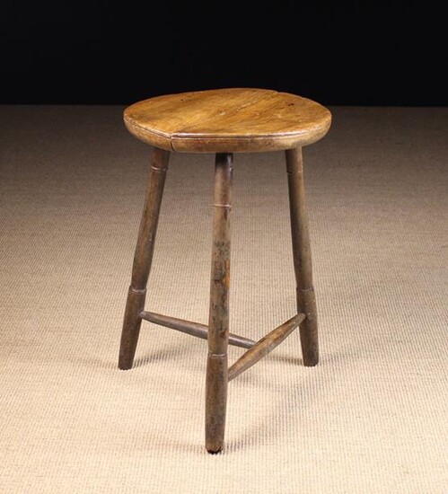 A 19th Century Cricket Table. The round twin plank