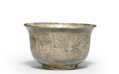 A chased and cast silver cup with gilt highlights