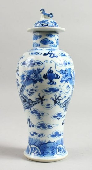 A 19TH CENTURY CHINESE BLUE AND WHITE VASE AND COVER.