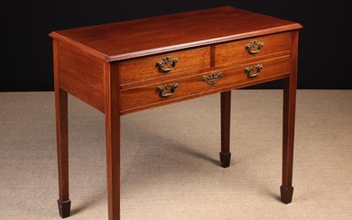 A 19th Century Mahogany Side Table. The rectangular top with moulded edge above three frieze drawers