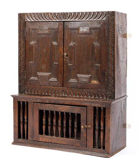 A 19th century oak bread and cheese cupboard