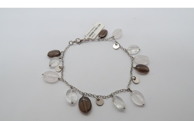 A 9ct white gold bracelet with hanging stones - ex jewellers...