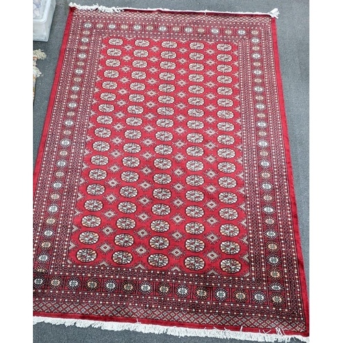 A Bokhara red ground carpet, 280 x 194cm