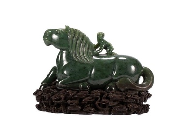 A CARVED SPINACH GREEN JADE HORSE