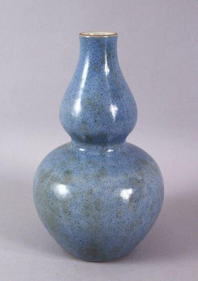 A CHINESE MONOCHROME PALE BLUE GLAZED PORCELAIN GOURD