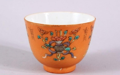 A CHINESE ORANGE GROUND PORCELAIN CUP, with an orange