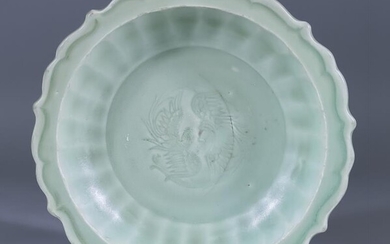 A Chinese Celadon Barbed Dish, the centre carved with...
