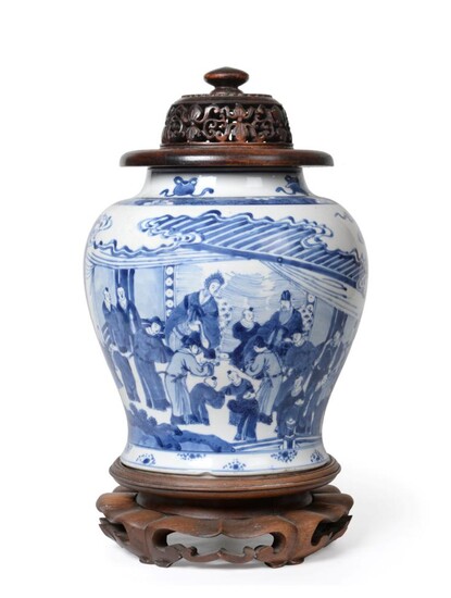 A Chinese Porcelain Jar, Kangxi, of baluster form, painted in underglaze blue with dignitaries...