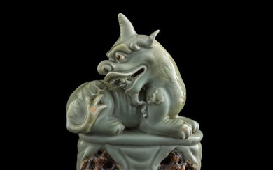 A Chinese carved celadon luduan figure, 19th century