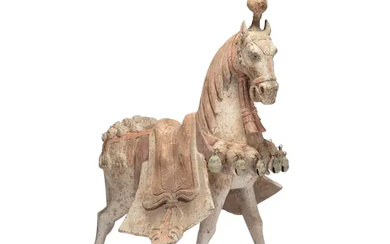A Chinese painted pottery figure of a caparisoned horse Northern Qi dynasty...